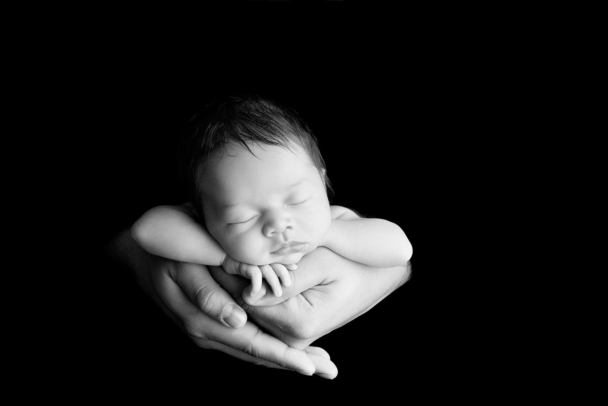 Newborn Photography in Parents Hands