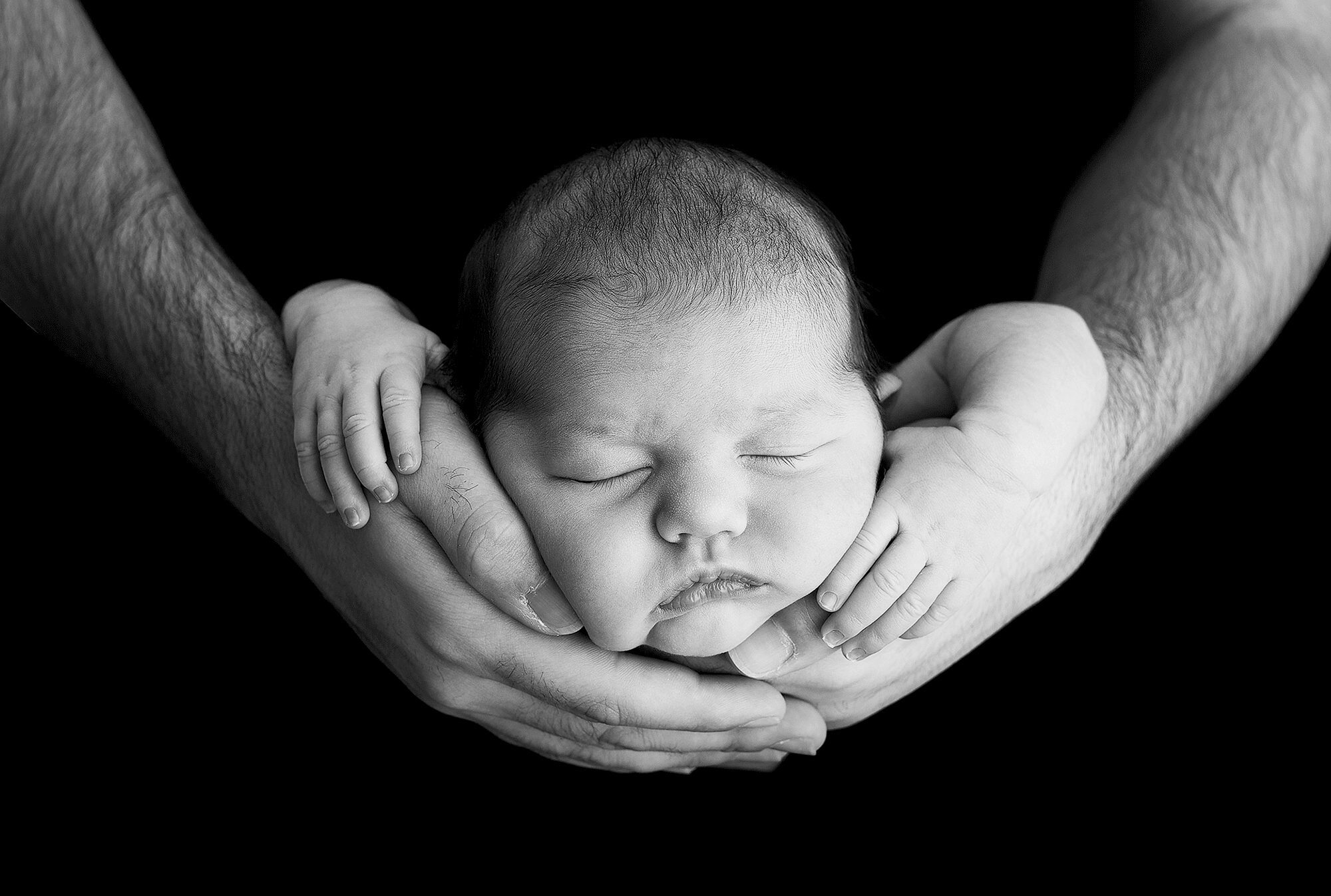In Dad Arms Picture with Baby Black and White