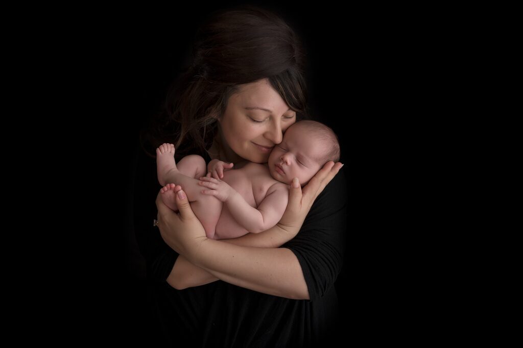 mom cradling her baby pic